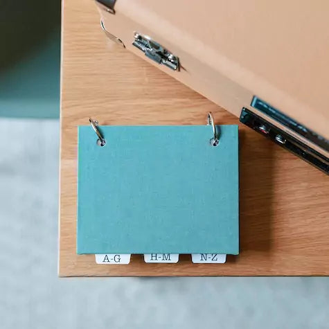 address book binder handcrafted by inawehandmade in teal linen book cloth.