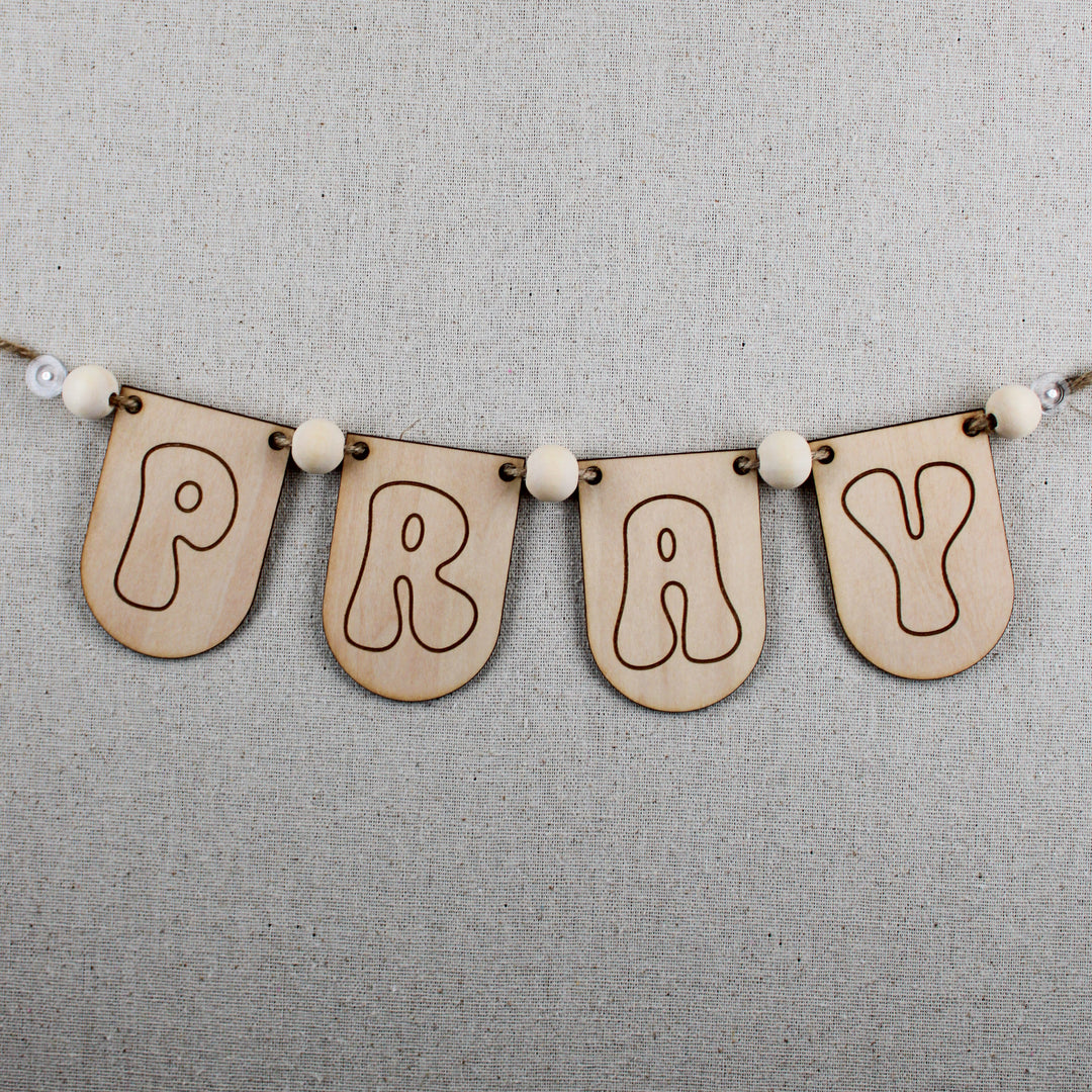 Groovy, wooden PRAY banner kit with wood beads and jute string for prayer boards or prayer room decor.