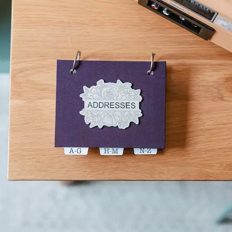 address book for seniors in elegant purple linen book cloth and laser engraved title for front cover.