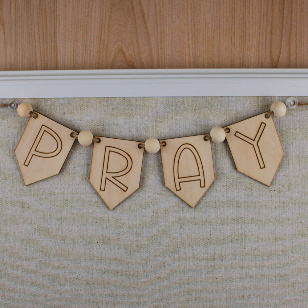 PRAY wood banner with wood beads and jute string for diy prayer board ideas.