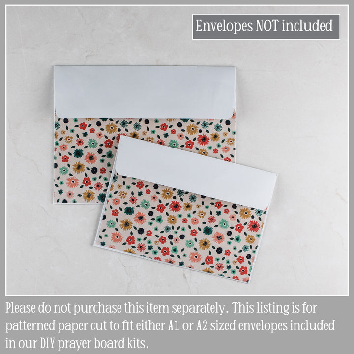 Floral-patterned envelope covers for prayer boards.
