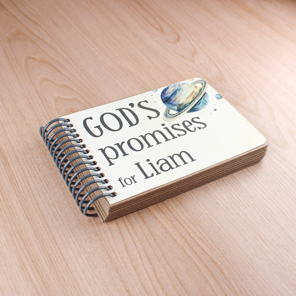 Personalized space gifts for kids with a planet on the front cover along with the title. Spiral bound God's promises for kids.