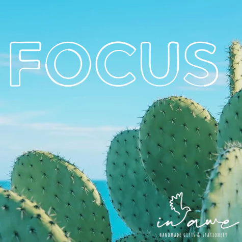 cactus in the foreground with FOCUS word of the year in white
