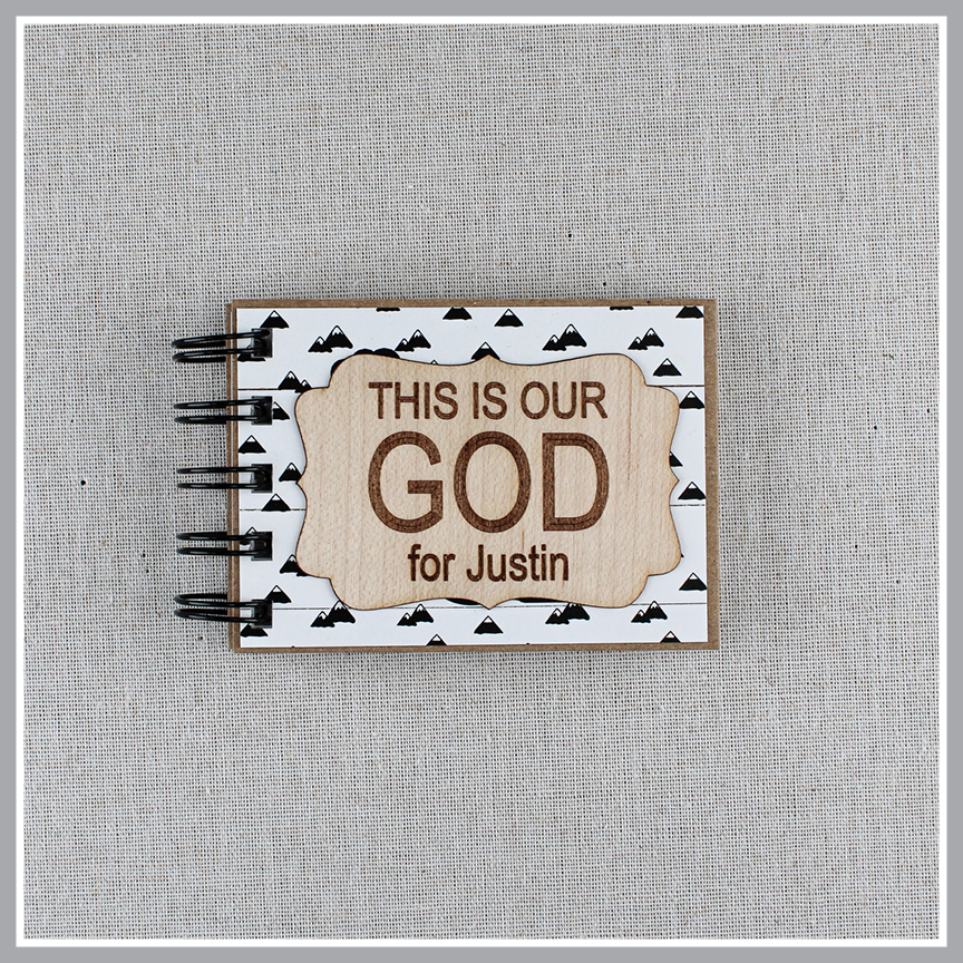 Personalized Mountains This Is Our God book with a laser-engraved wood nameplate.