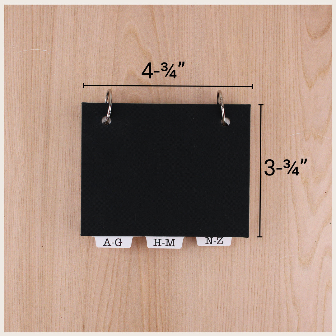 Black address book with dimensions marked as 4¾ inches wide by 3¾ inches tall.