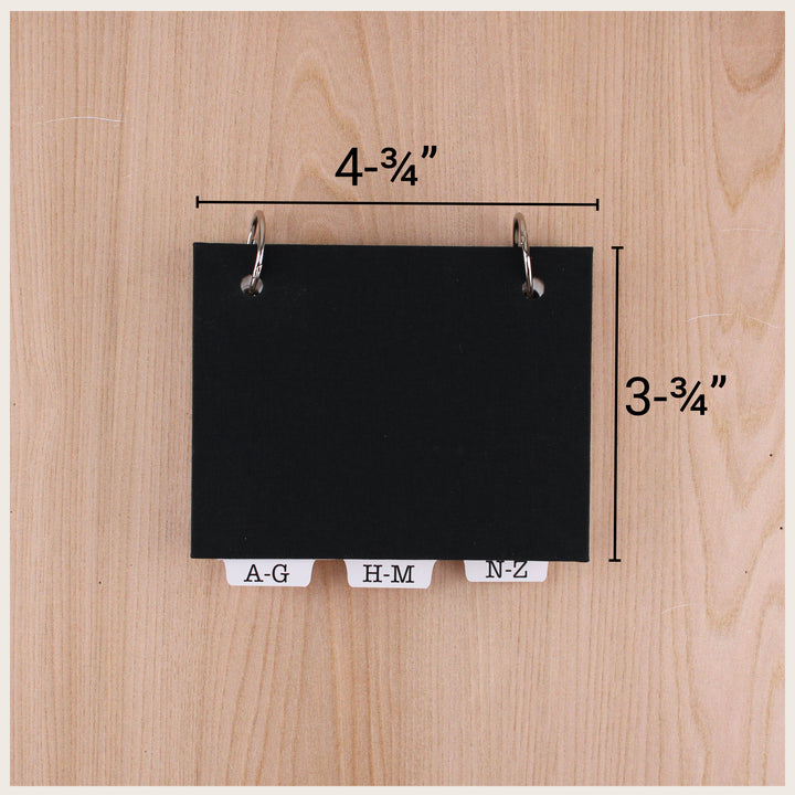 Black address book with dimensions marked as 4¾ inches wide by 3¾ inches tall.