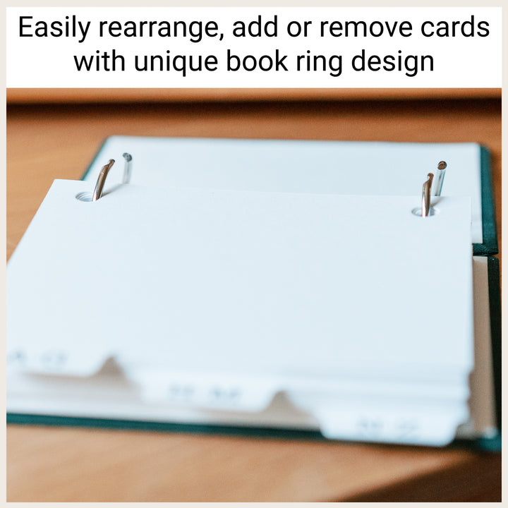 Open metal book rings showing how address cards can be added, removed, or rearranged.