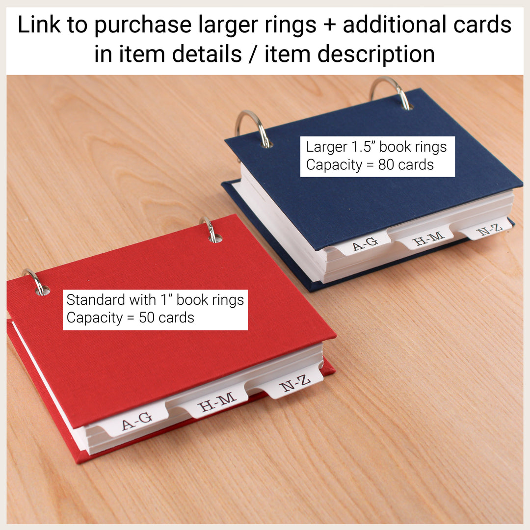 Comparison of address books with 1-inch rings holding approximately 50 cards and larger 1½-inch rings holding approximately 80 cards.