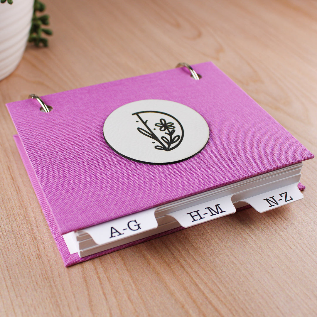 pink address book with refillable pages and alpha tabs