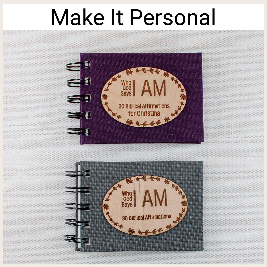 Plum and charcoal affirmation books with floral oval wood plaques, showing versions with and without name personalization.