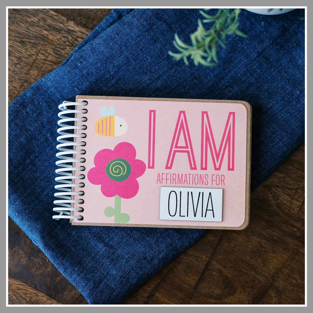 Personalized Pink Girly affirmation book for kids with laser-engraved nameplate reading OLIVIA.
