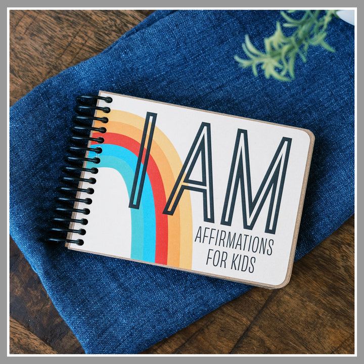 Rainbow book of positive affirmations for kids with ivory background and retro rainbow graphics.