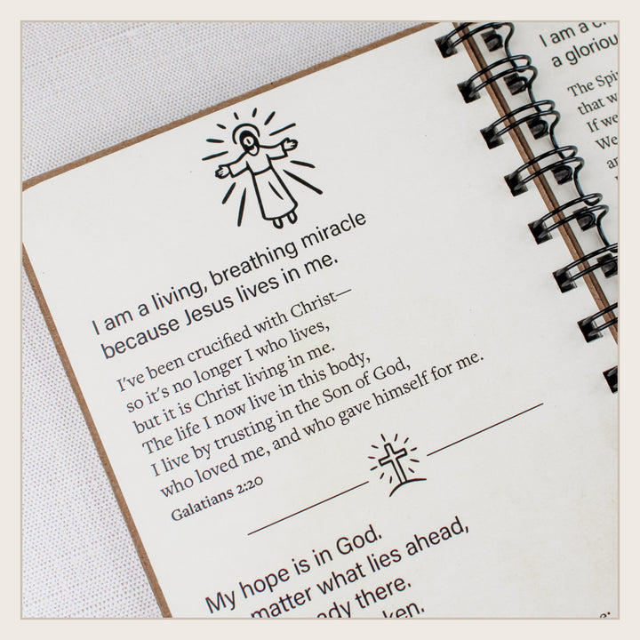 Close-up of a Christian affirmation and Galatians 2:20 about Christ living in the believer.