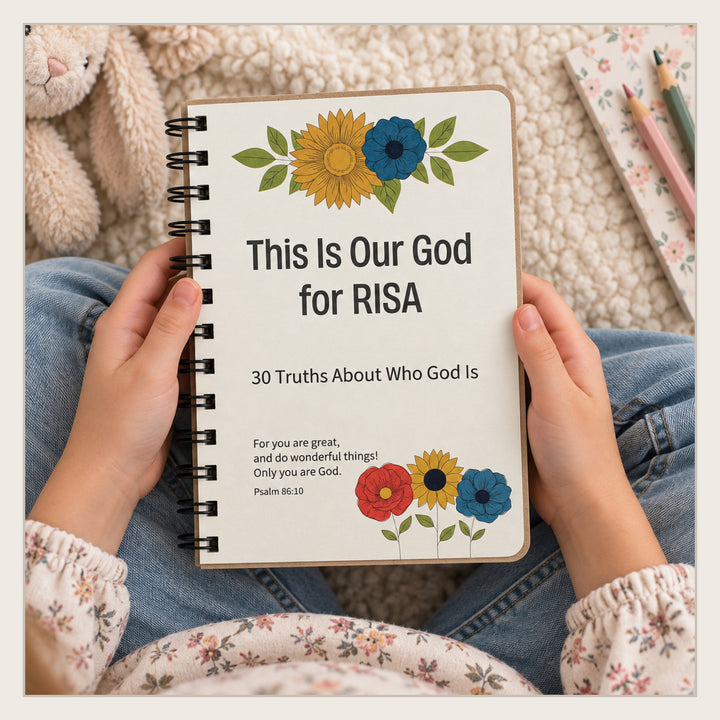Child holding personalized Christian book about 30 truths of who God is.