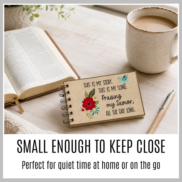 Small Christian journal beside an open Bible and coffee for prayer, gratitude and daily quiet time.