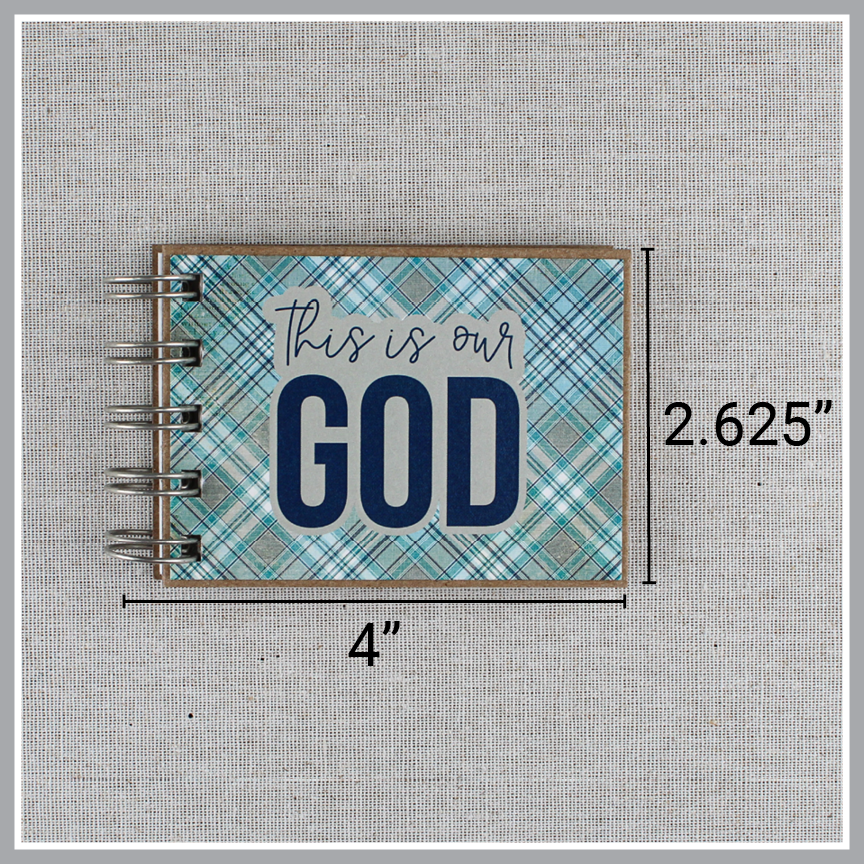 Dimensions of spiral-bound book with 'This is our God' text on a plaid blue and gray cover. It is 4" wide and 2.625" tall.