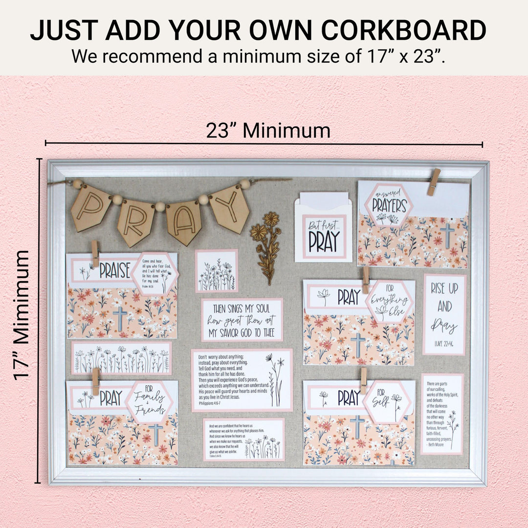Completed DIY prayer board on a corkboard with recommended minimum size of 17 by 23 inches.