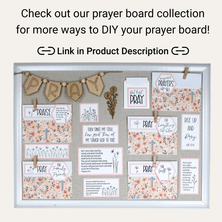 Completed DIY prayer board with a wood banner, prayer envelopes, Bible verses and floral decorations.