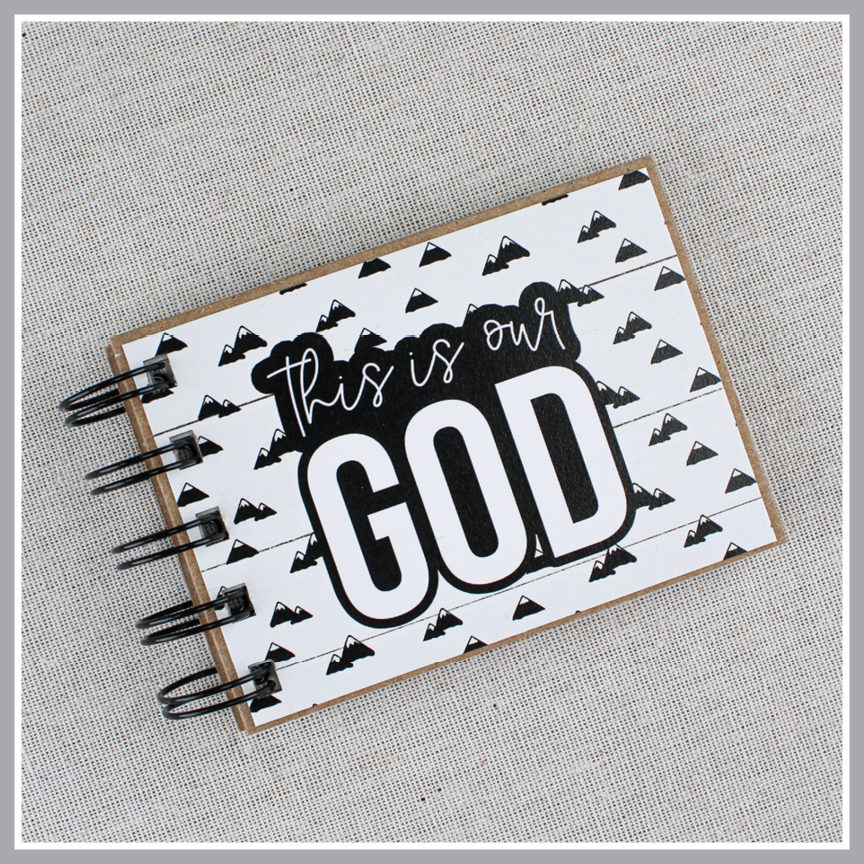 Attributes of God book with "this is our GOD" on the front cover of Mountains style.