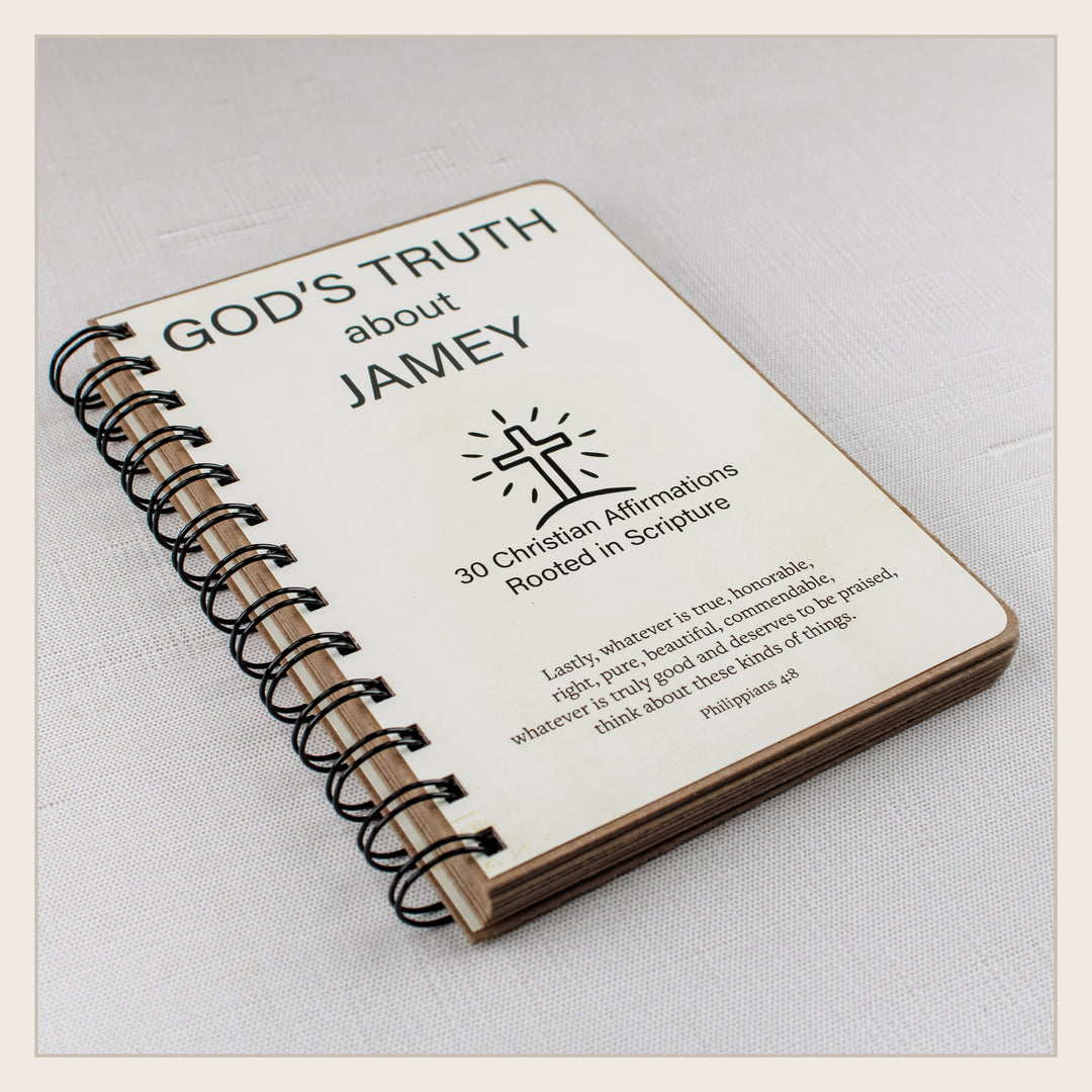 Angled view of the handmade spiral Christian affirmation book showing its sturdy layered construction.
