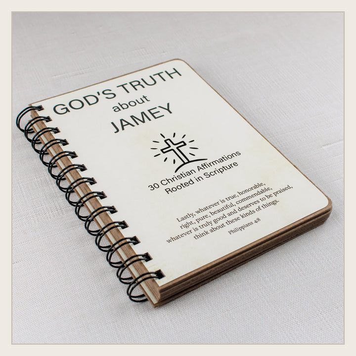 Angled view of the handmade spiral Christian affirmation book showing its sturdy layered construction.