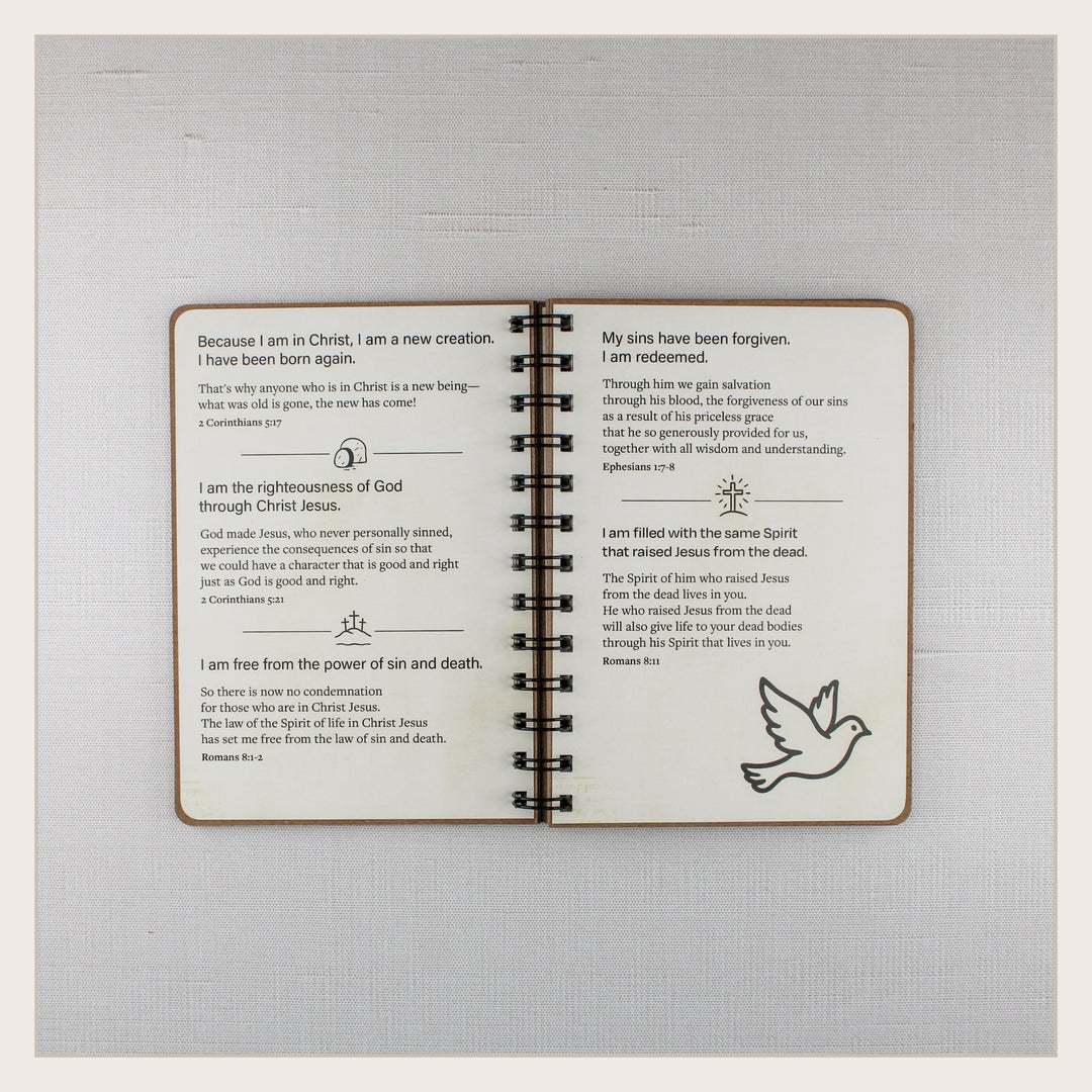 Open Christian affirmation book with biblical truths about new life in Christ, redemption and the Holy Spirit.