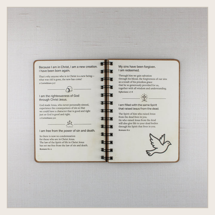 Open Christian affirmation book with biblical truths about new life in Christ, redemption and the Holy Spirit.