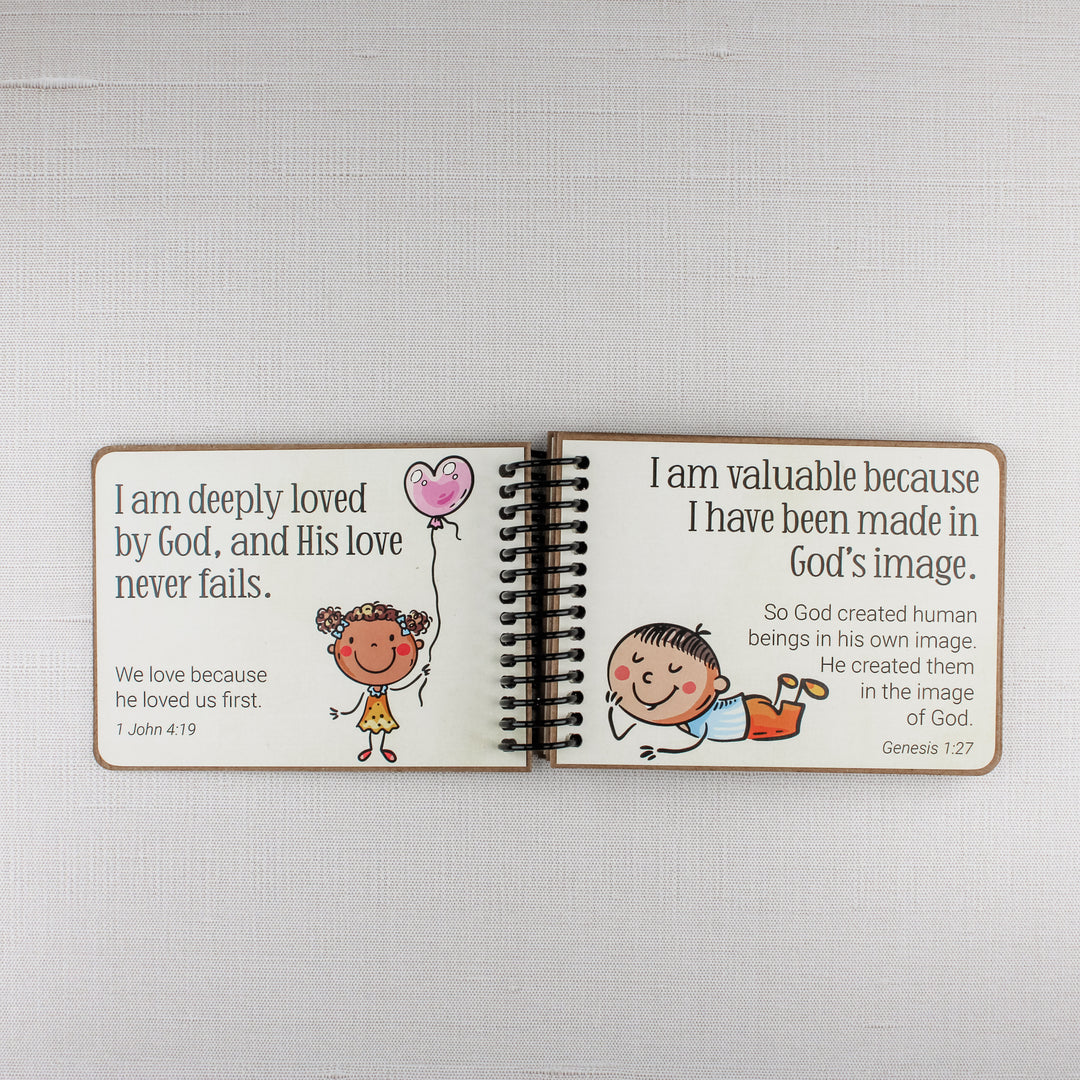Bible affirmations for children teaching that they are loved by God and made in God's image.
