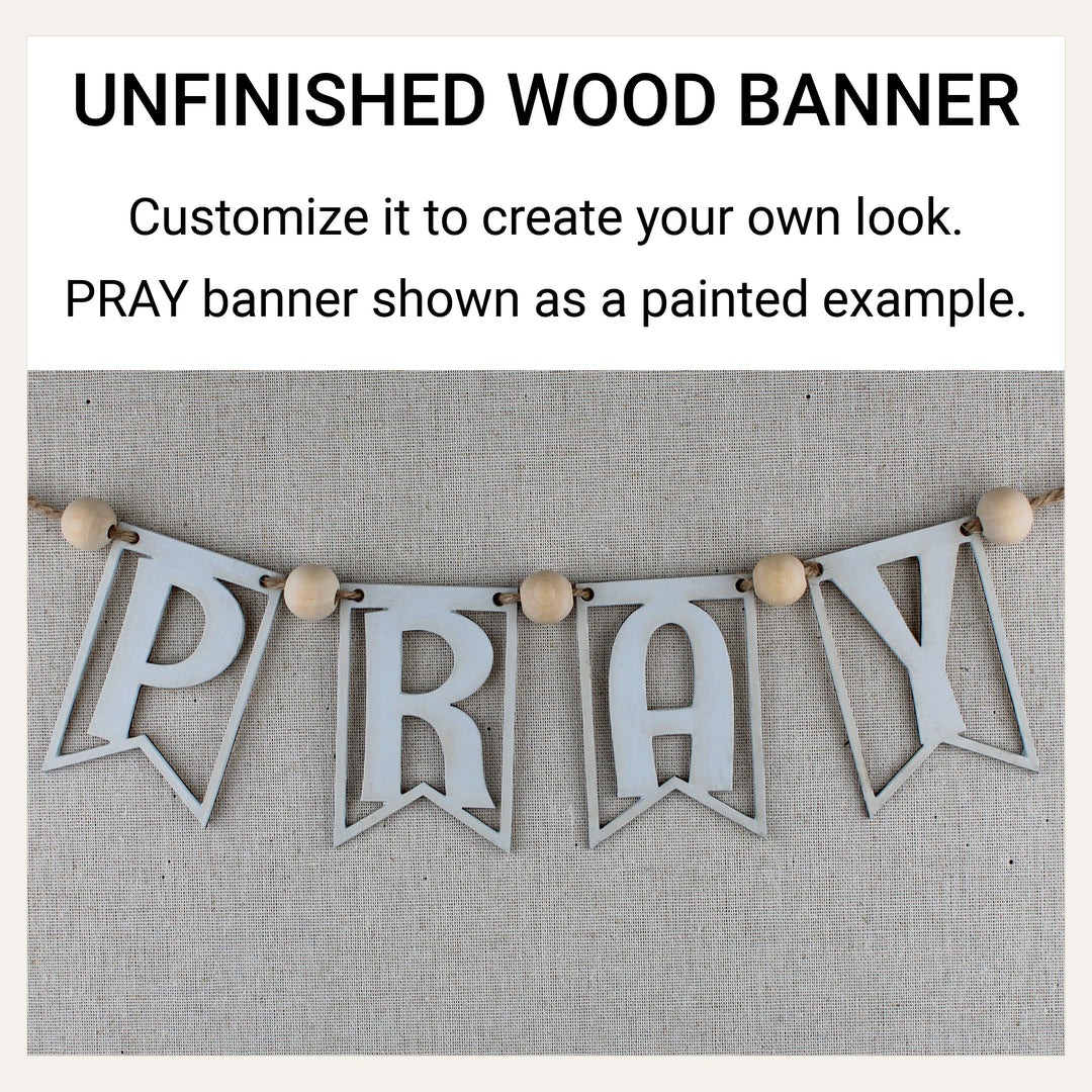 White-painted wooden PRAY banner demonstrating how unfinished wood banner pieces can be customized.