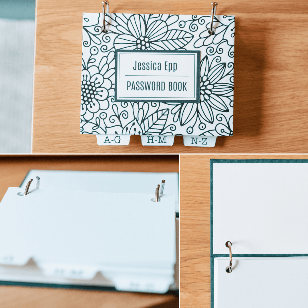 Password book with black and white floral design on a wooden surface. Open book rings to show design. Close up of high-quality handmade craftsmanship.