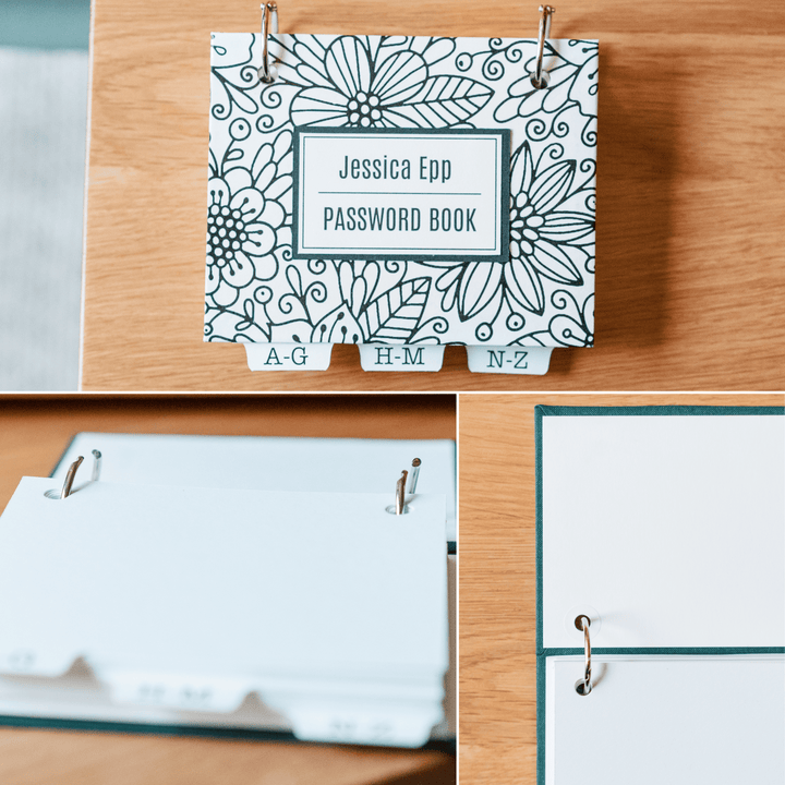 Password book with black and white floral design on a wooden surface. Open book rings to show design. Close up of high-quality handmade craftsmanship.