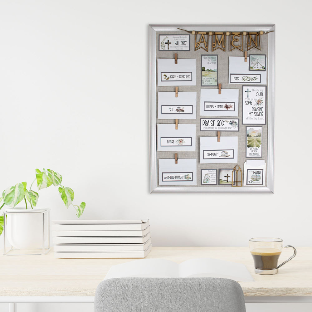 Prayer board with church hymn lyrics, Amen banner hanging above a desk.