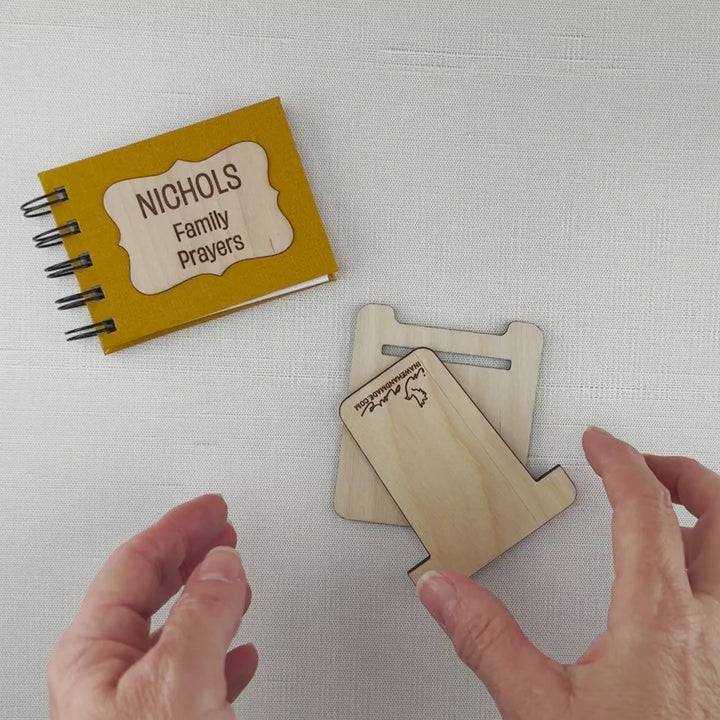 video of assembling optional wood display easel for family prayer book.