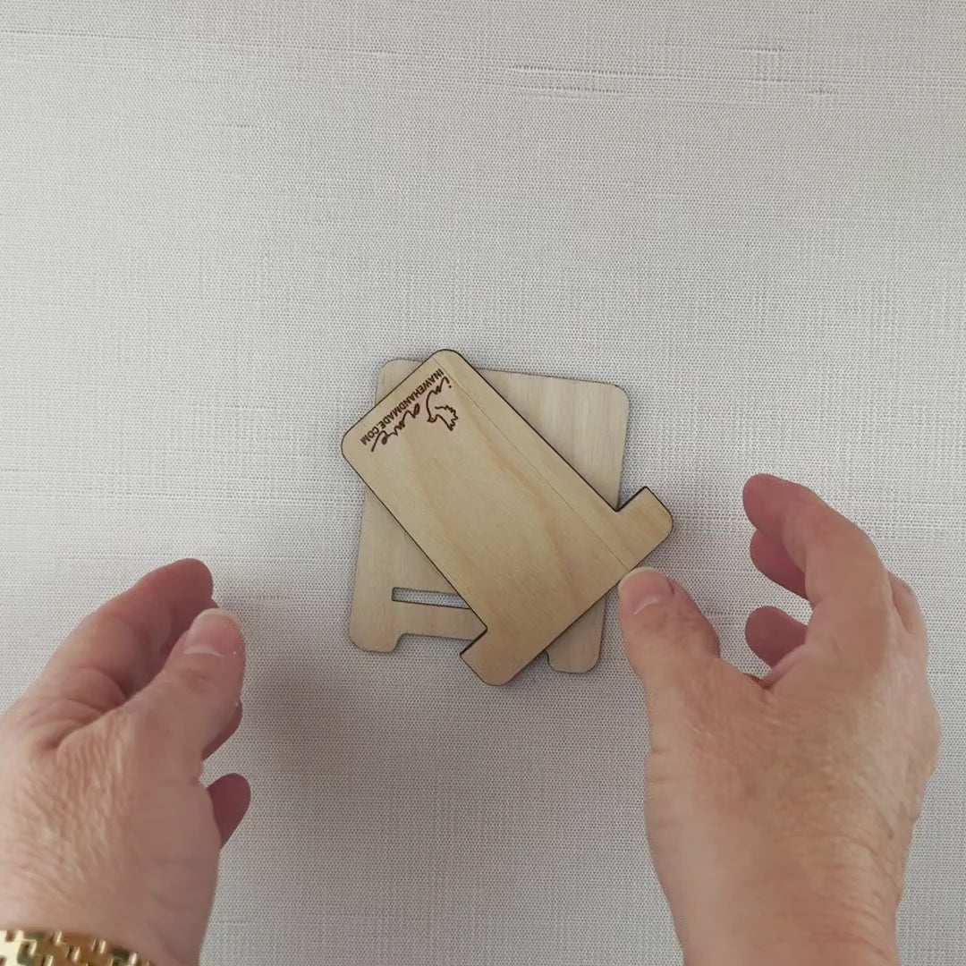 Wood easel assembly video - place piece with logo face-up into slot of the other piece.