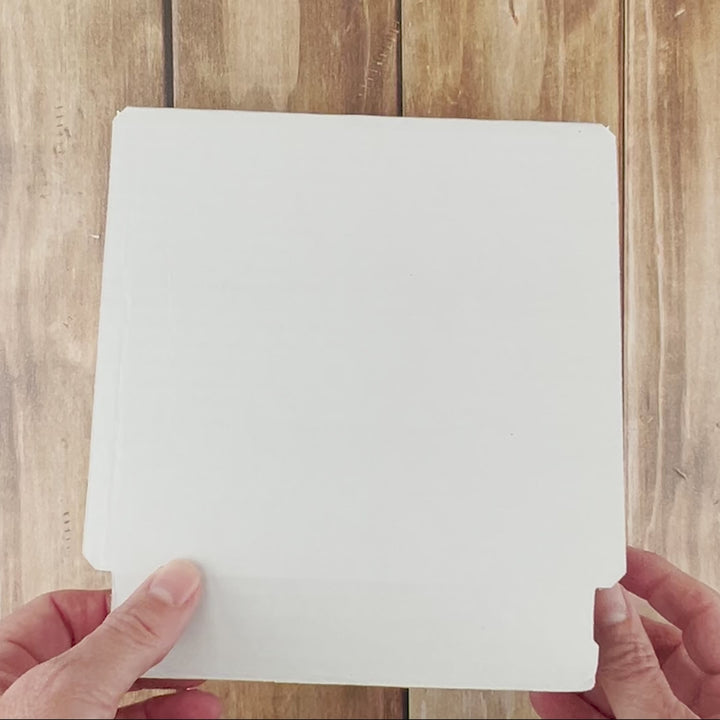 Unboxing a physical Wildflower DIY prayer board kit with prepared pieces, envelopes, wood banner and supplies.