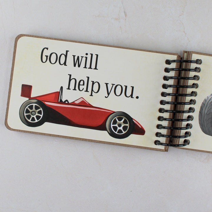 Close up of page with red race car and text 'God will help you'.