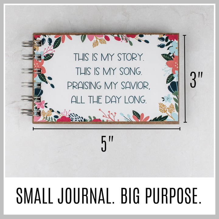 Flower frame Christian journal showing its compact 5 by 3 inch size.
