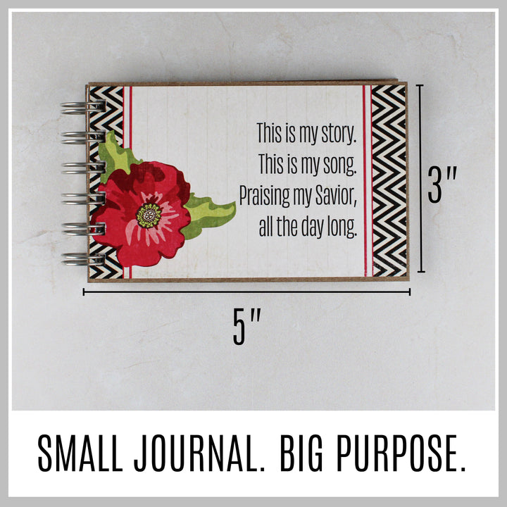 Red Flower Christian journal showing its compact 5 by 3 inch size.