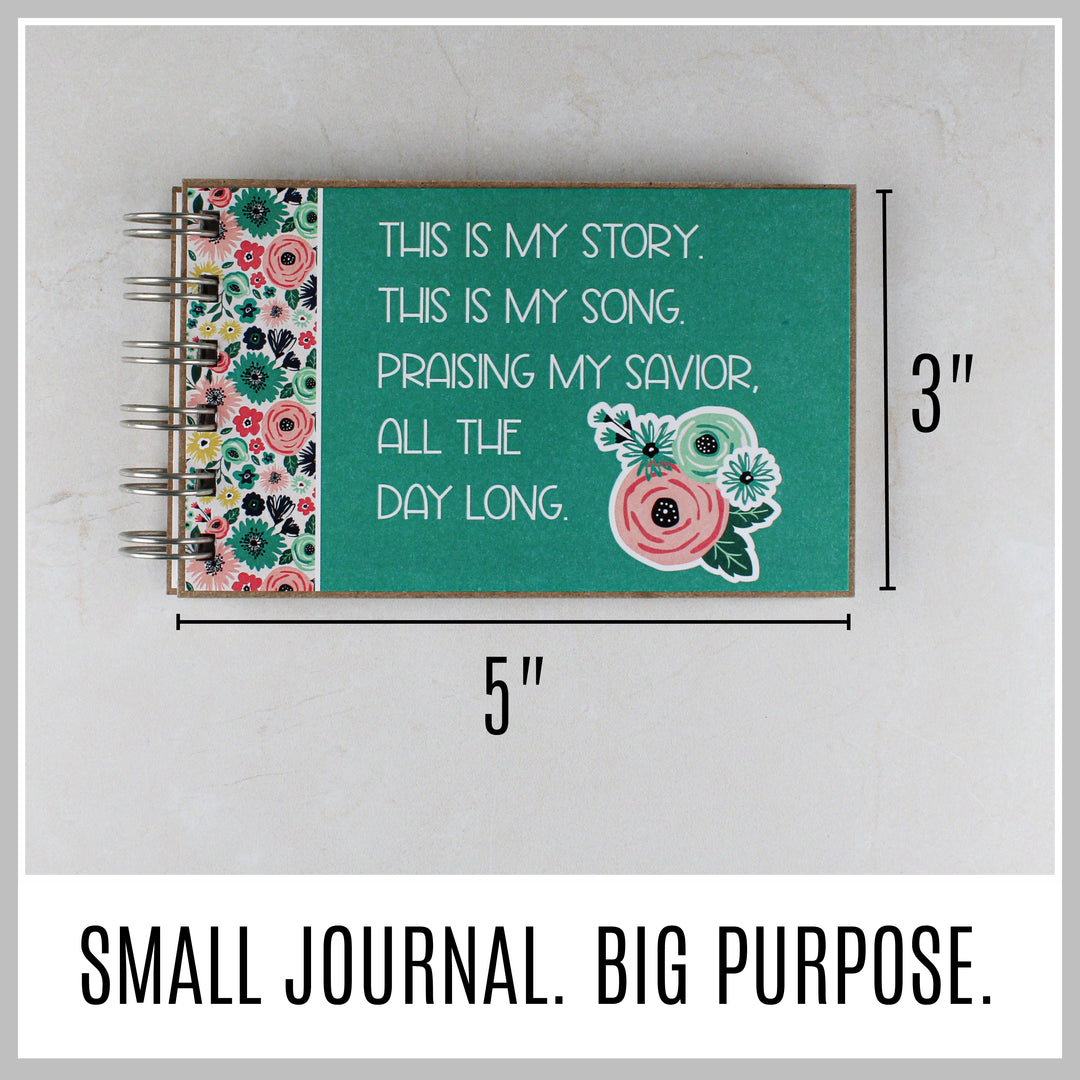 Teal Christian journal showing its compact 5 by 3 inch size.