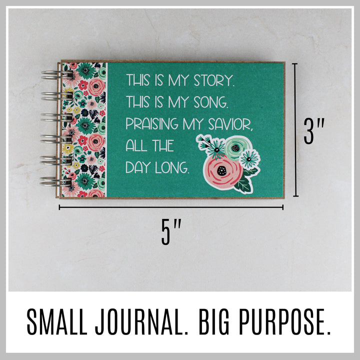 Teal Christian journal showing its compact 5 by 3 inch size.