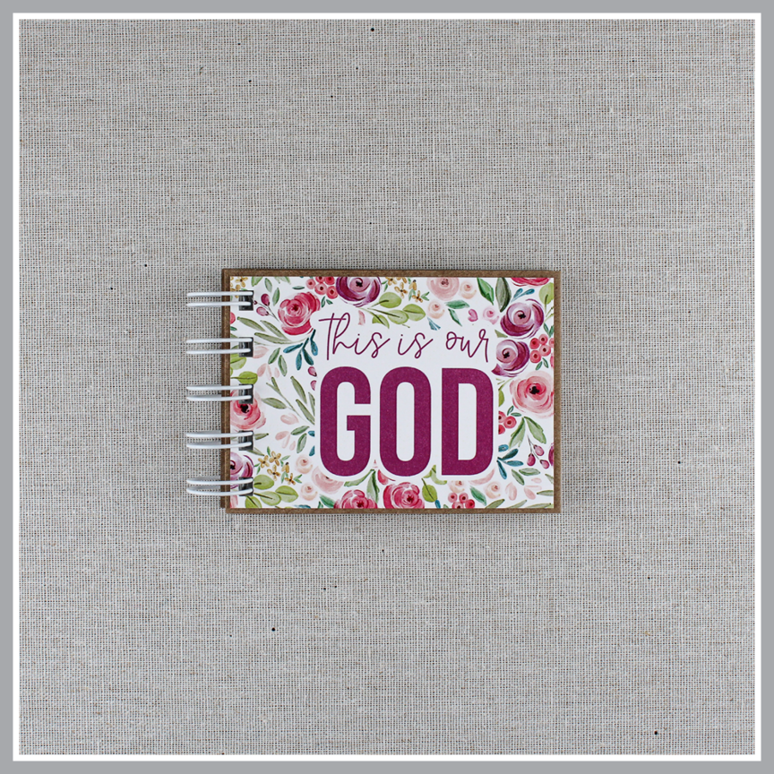 God's attributes book spiral bound in Pastel Floral style with pink and purple floral background. Front cover says "this is our GOD".