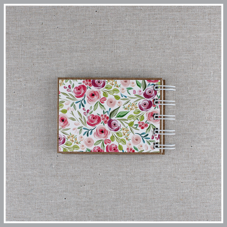 Back cover of God's attributes book spiral bound in Pastel Floral style with pink and purple floral background. 