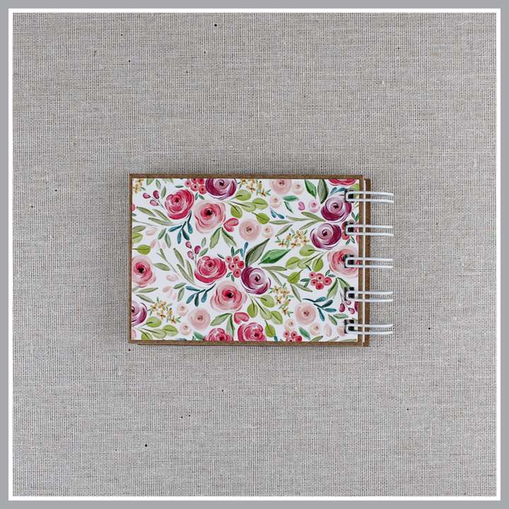 Back cover of God's attributes book spiral bound in Pastel Floral style with pink and purple floral background. 