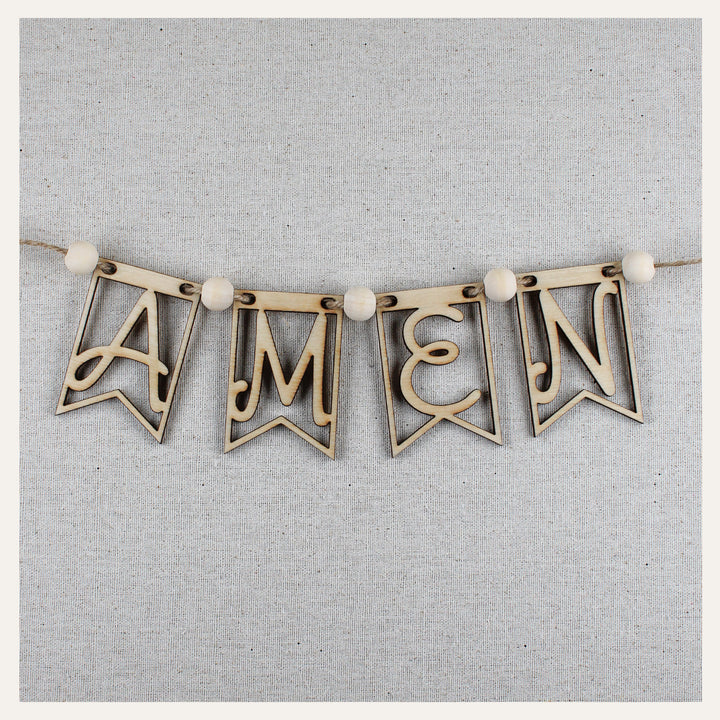 Assembled wooden AMEN banner with natural wood beads and jute string for prayer wall decor.